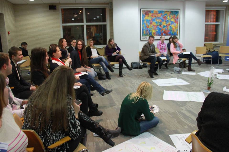 Group sitting in classroom chairs