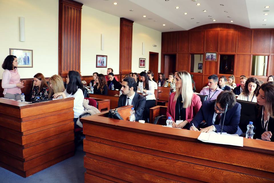 Wide shot of a court room full of people