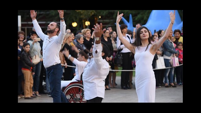 Close up shot of graceful dancers in Armenia wearing white