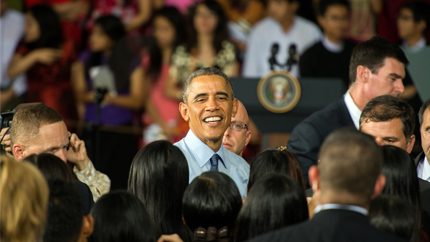 President Obama in the midst of a crowd of people.