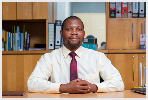 headshot of Mr. Tawanda Collins Muzamwese