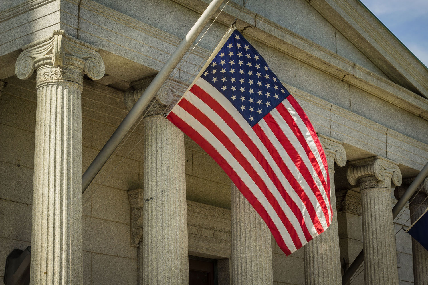 American flag in front of courthouse