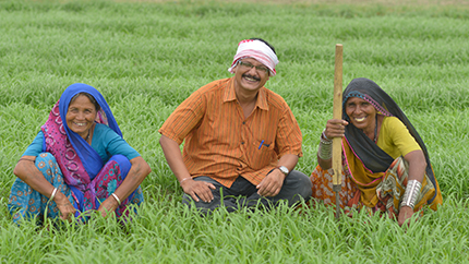 Biplab Ketan Paul (center) poses with farmers he helped through his innovative "Bhungroo" farming method.