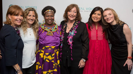 Group of smiling women posing for a photo