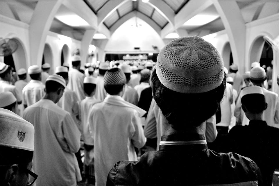 This image captures the fourth of five daily prayers at a southern Thailand Muslim boarding school.  