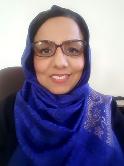 Headshot of woman wearing head wrap