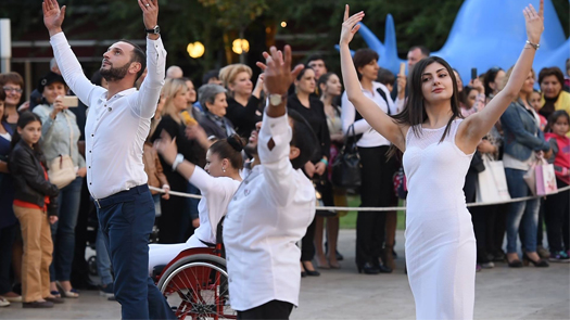 Close up shot of graceful dancers in Armenia wearing white