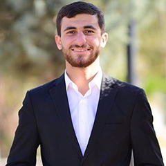headshot of Omer