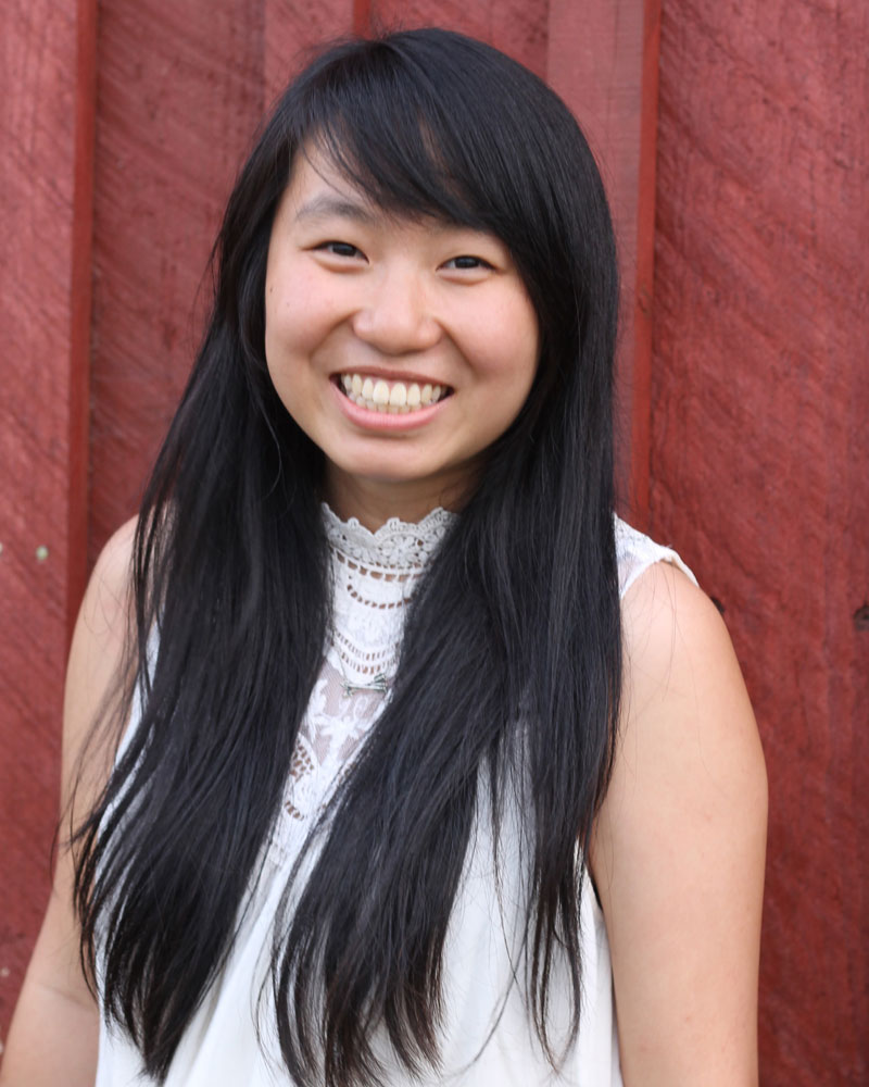 Young woman with long hair smiling