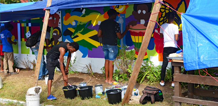 Participants working on standpipe mural