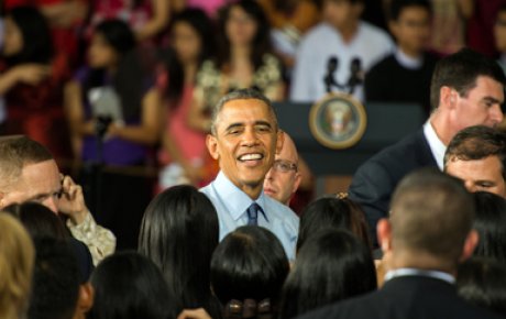 President Obama in the midst of a crowd of people. 