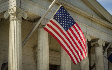American flag in front of courthouse