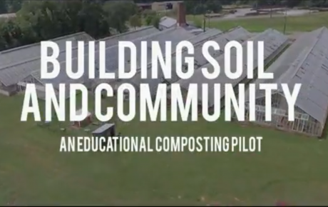 Aerial shot of greenhouses with title graphic overlay