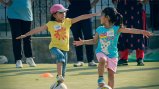 Two young players engage in a skills drill at a GO GIRL Pakistan camp Two young players engage in a skills drill at a GO GIRL Pakistan camp