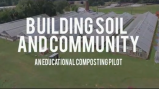 Aerial shot of greenhouses with title graphic overlay